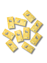 Ten yellow Scandinavian chocolate bars, each featuring a black horse illustration and visible Nordic branding, scattered on a white background.