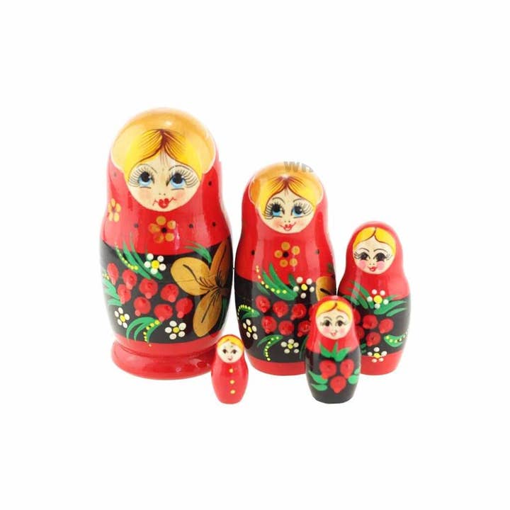 The "Red 4-inch Nesting Doll Red Floral" features five hand-painted dolls crafted from linden wood, decorated with floral patterns, and displayed in descending size order from left to right.