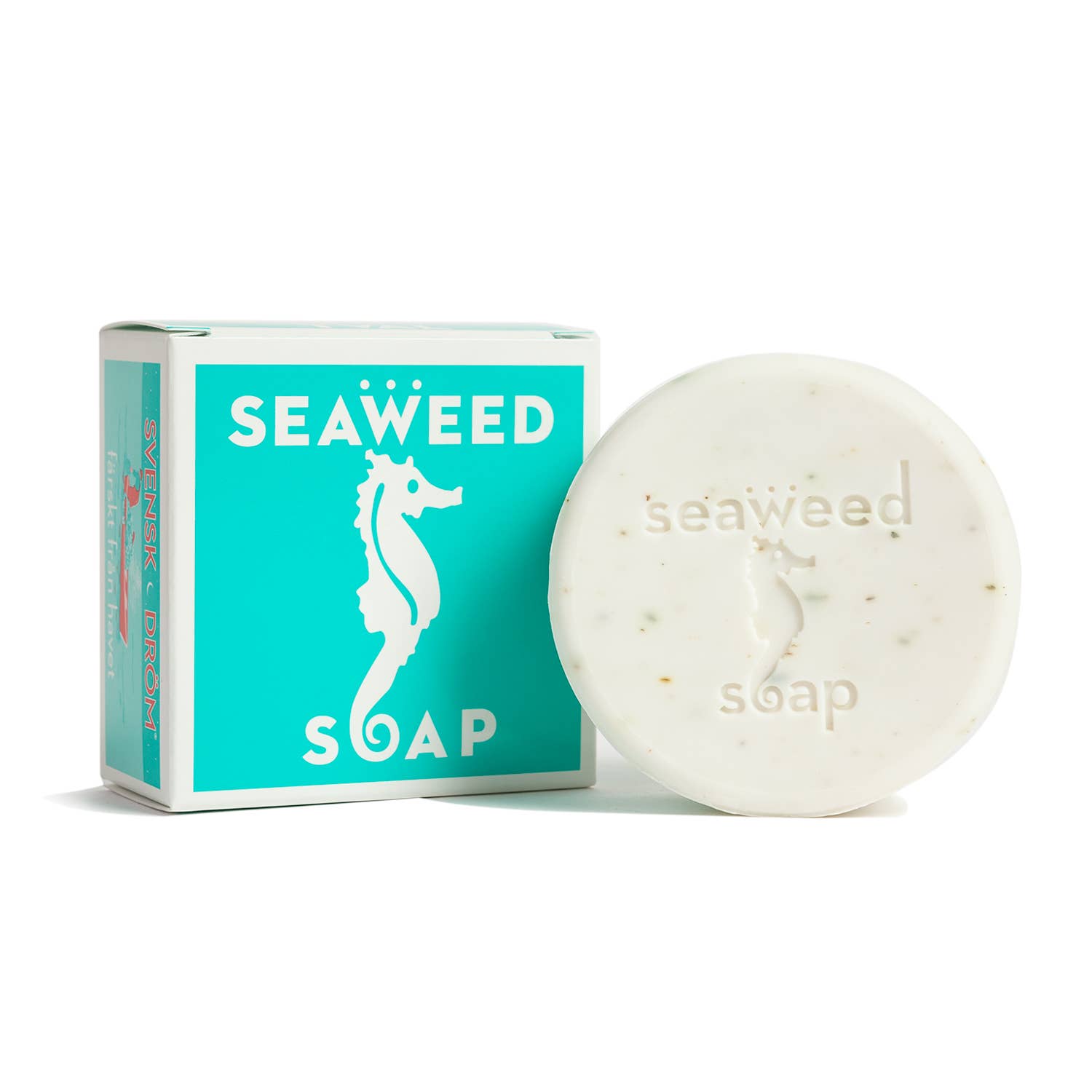 A round white 4.3 oz Swedish Dream Seaweed Bar Soap, embossed with a seahorse, is shown next to its turquoise and white box with a matching seahorse graphic. This vegan soap refreshes and invigorates.