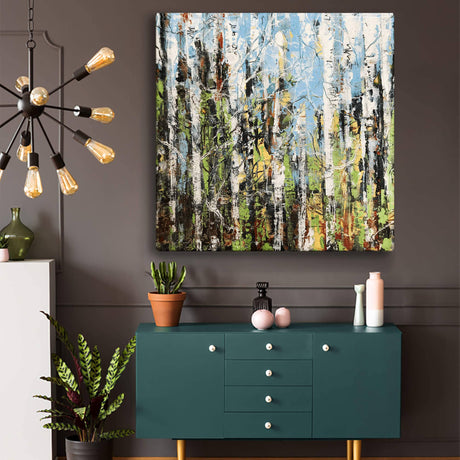 A modern living room showcases a green cabinet with plants, plus striking "Wall Decor: Aspen Forest I - Metal Box Art: Aluminum Box / 18" x 18" x 3"" as wall art on a dark gray wall.