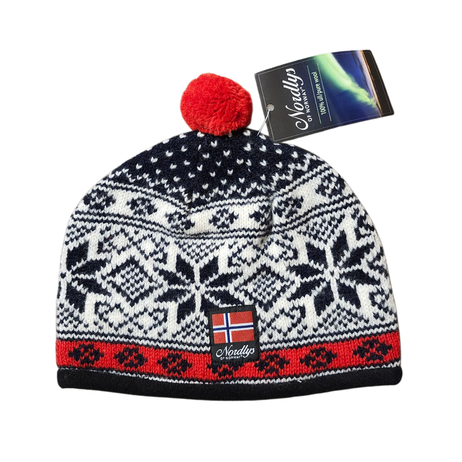 The Nordlys Classic Norwegian Star Knit Hat (Navy/Red) is a cozy knit winter hat with a red pom-pom, featuring white, black, and red Nordic star patterns, a Norwegian flag patch, and a tag—showcasing classic Scandinavian craftsmanship.