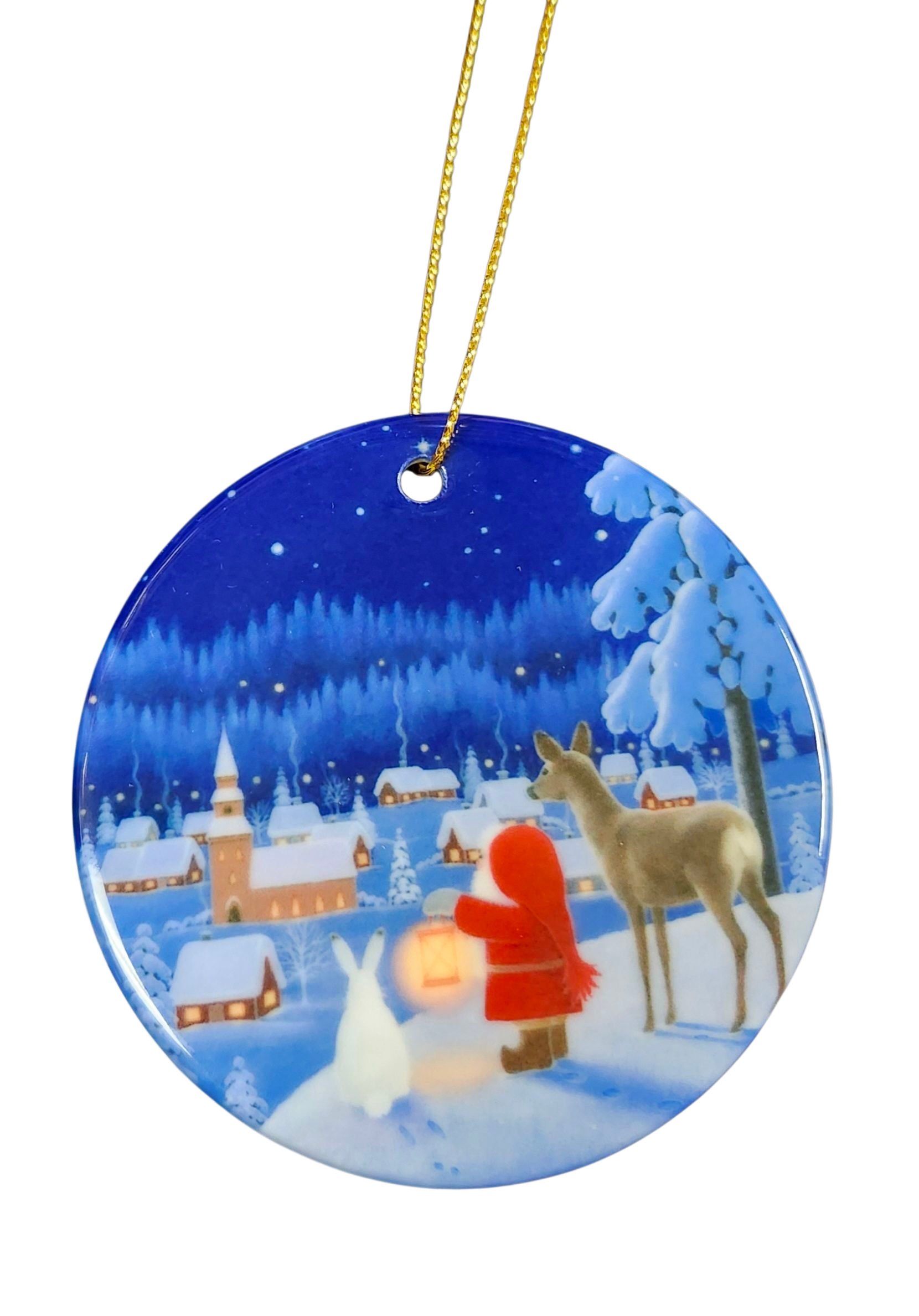 The "Tomte Reindeer & Rabbit" porcelain ornament by Eva Melhuish features a snowy village, child in red, deer with lantern, and rabbit—capturing her beloved Scandinavian holiday illustration style.