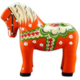 The Dala Horse: Färnäshästen Red by Nils Olsson (14 cm) is a hand-carved Swedish figurine, decorated in vibrant patterns and standing proudly on four legs.