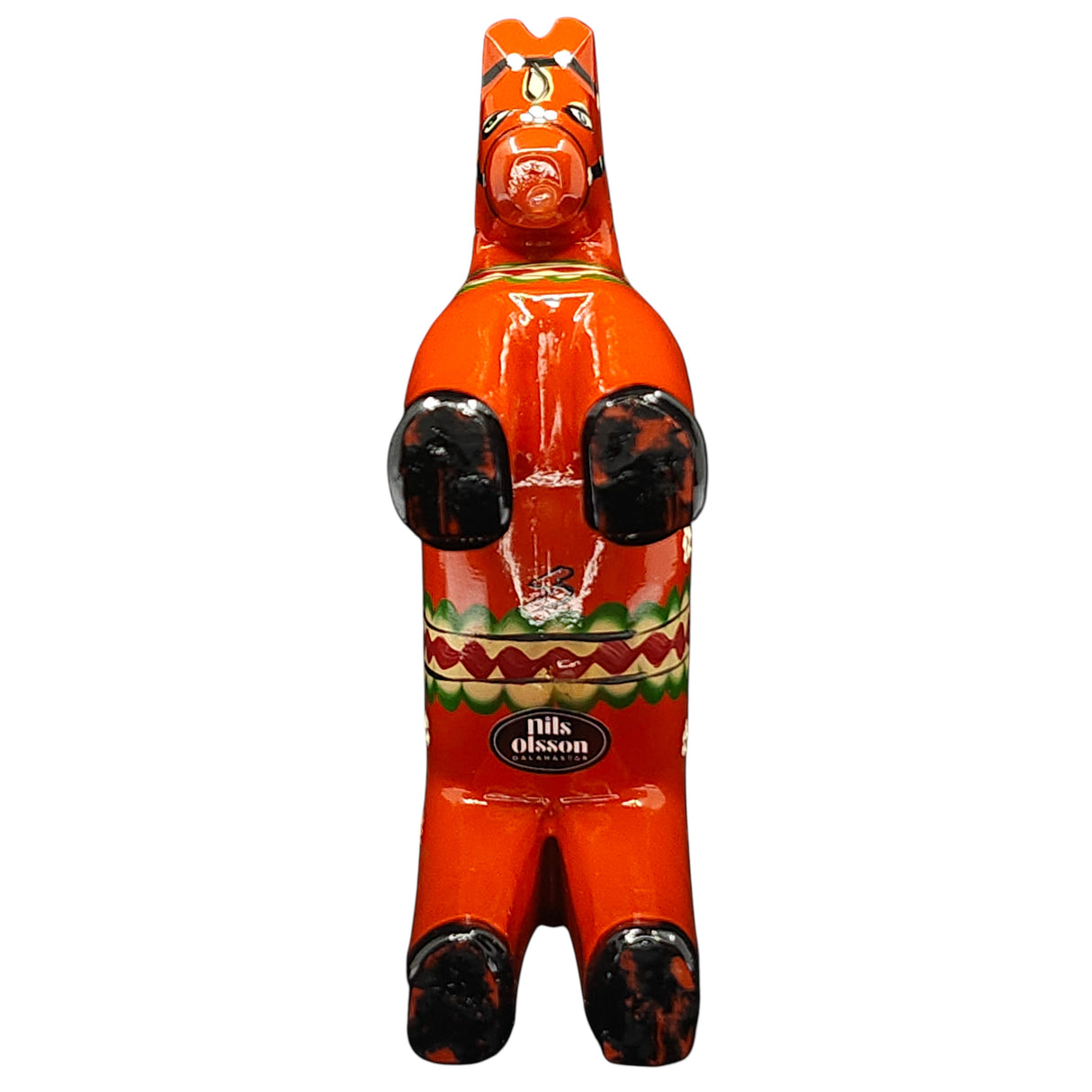 The Dala Horse: Färnäshästen Red is a 14 cm hand-carved Swedish Dala Horse by Nils Olsson, featuring black hooves, traditional patterns, and a visible Nils Olsson label on its body, shown from the front.