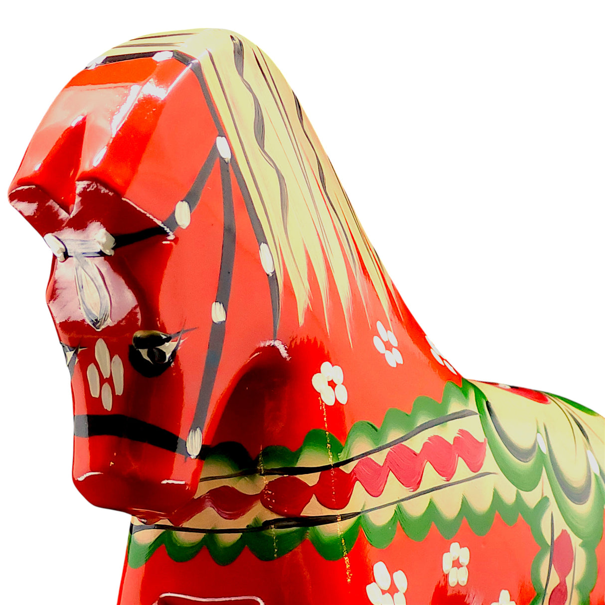 Close-up of the Dala Horse: Färnäshästen Red, a 14 cm hand-carved Swedish Dala Horse by Nils Olsson, painted red with green, white, and yellow floral patterns, shown on a white background.