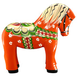 The Dala Horse: Färnäshästen Red by Nils Olsson (14 cm) is a hand-carved Swedish wooden figurine featuring green, white, black, and yellow decorative patterns with small white flowers.