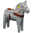 The Dala Horse: "Love Horse" Karlekshast 13cm (5") is a hand-carved wooden Swedish figurine featuring floral patterns in blue, yellow, and brown on a light gray background.