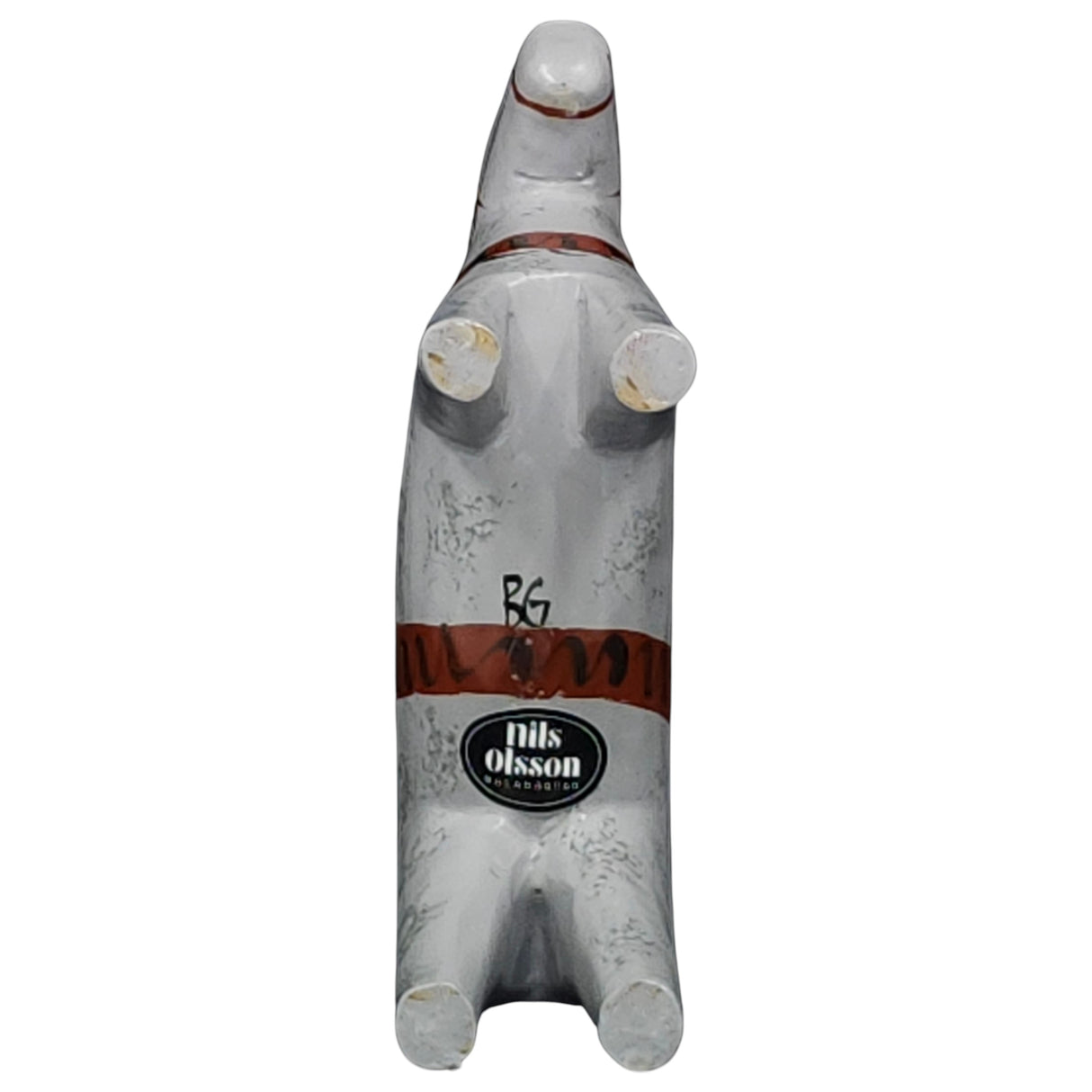 The Dala Horse: "Love Horse" Karlekshast 13cm (5") is a hand carved wooden figurine, painted gray with red harness details. Viewed from below, it features the Nils Olsson label and initials BG—ideal for adding Swedish heritage décor to any space.