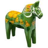 The Dala Horse: Salenhasten 13cm (5" tall) is a hand-painted green wooden figurine with yellow and orange flower patterns and white detailing, highlighting exquisite Swedish craftsmanship.