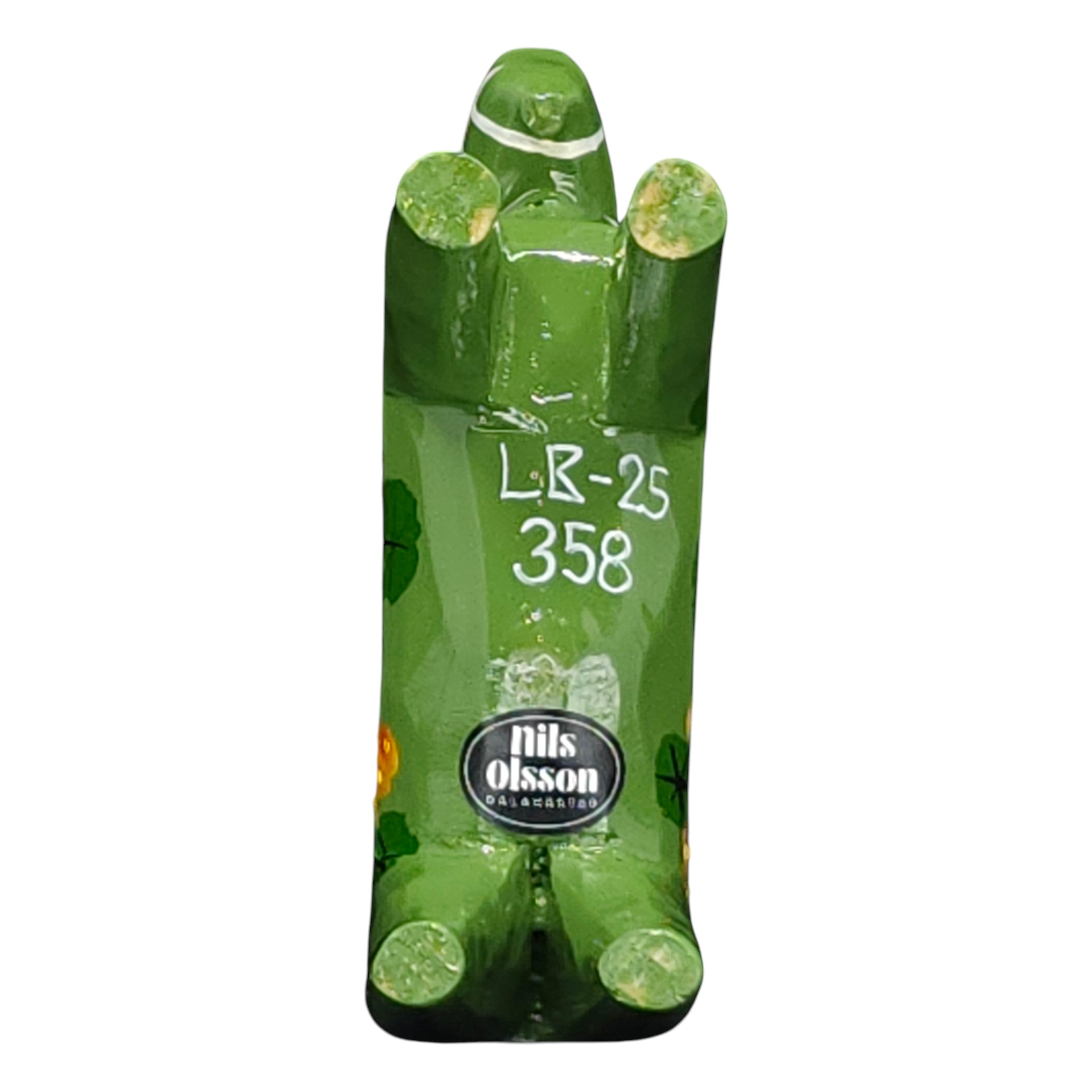 The Dala Horse: Salenhasten 13cm (5" tall) is a green, hand-painted wooden figurine. Viewed from below, it shows Swedish craftsmanship with visible LR-25 358 and the Nils Olsson label, exemplifying traditional artistry.