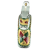 A painted ceramic figurine inspired by an antique Swedish Dala horse, featuring floral and geometric designs in green, red, yellow, and white. Product: Dala Horse: Antique Inspired Swedish Dala Horse White with Gray Feet 17cm.