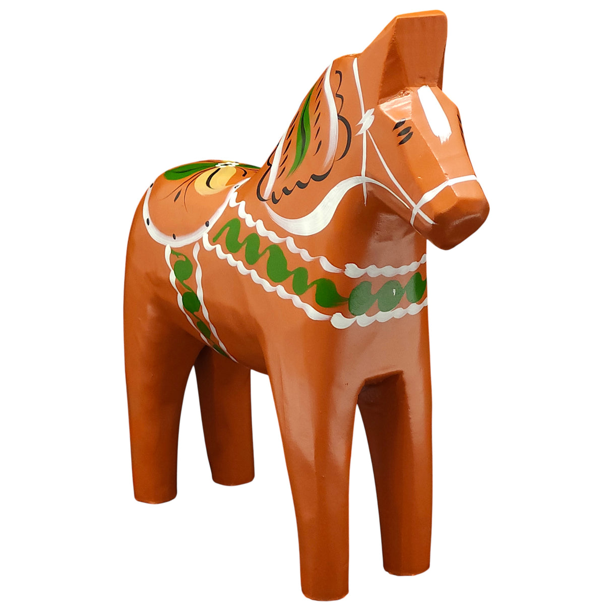 The Gammelröd Old Red Swedish Dala Horse is a 16 cm hand-carved figurine featuring traditional Scandinavian craftsmanship with green, white, and yellow decorative patterns.