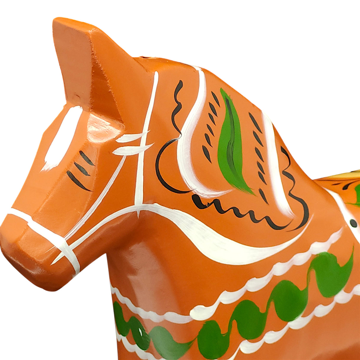 Close-up of the Gammelröd Old Red Swedish Dala Horse—a 16 cm hand-carved figurine—featuring traditional Scandinavian craftsmanship and decorative green, white, and black painted patterns.