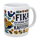 The Swedish Gift Store’s 11 oz ceramic “Swedish Fika Traditions” mug features colorful folk art—pastries, flowers, blue bird—and bold “FIKA EN SVENSK TRADITION KAFFEPAUS.” Perfect for your coffee break.