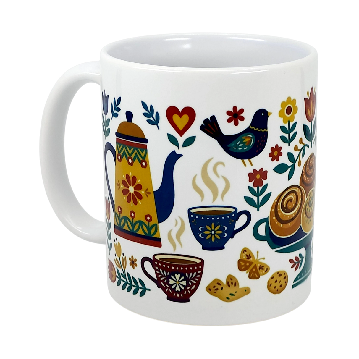 The Swedish Gift Store’s 11 oz "Mug: Swedish Fika Traditions Wraparound Ceramic Mug" features colorful folk art of a teapot, cups, bird, heart, flowers, cinnamon rolls, and cookies on white ceramic.