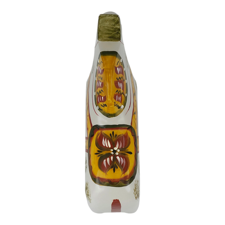 Hand-painted Dala horse wooden shoe viewed from above, decorated with yellow, orange, red, green, and white floral and geometric patterns.