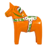 Orange Swedish Dala horse with green, white, and pink painted patterns, shown on a plain white background.