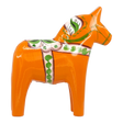 Orange Swedish Dala horse made of wood, decorated with green and white painted patterns, standing upright on a white background.