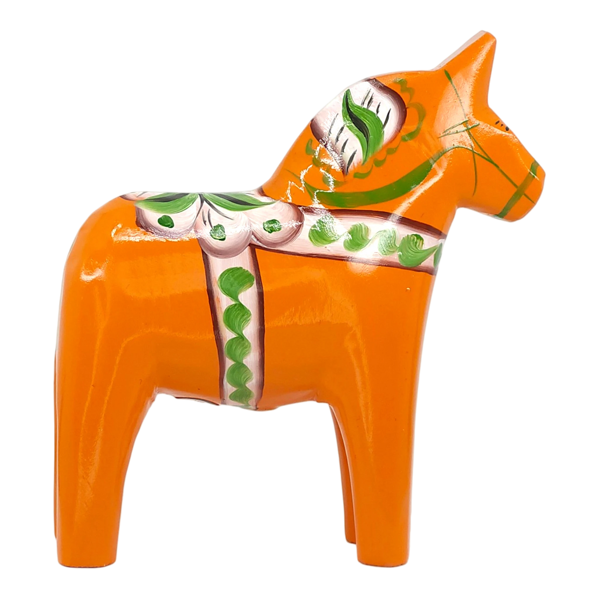 Orange Swedish Dala horse made of wood, decorated with green and white painted patterns, standing upright on a white background.
