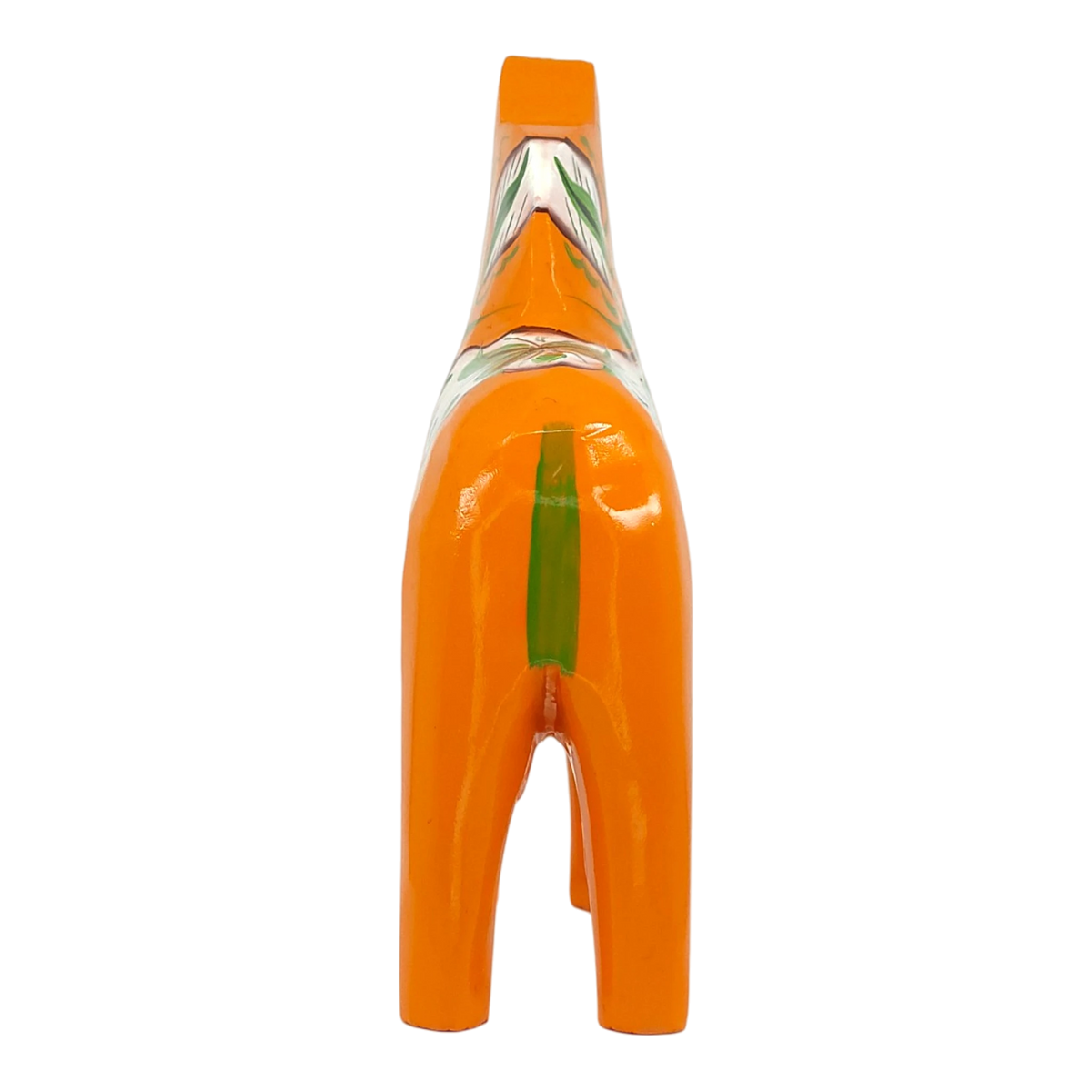 Orange Dala horse figurine shown from behind, featuring a green stripe and painted patterns on its back. Plain white background.
