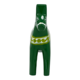 Green Dala horse figurine with white and yellow patterns on its body, displayed against a white background.