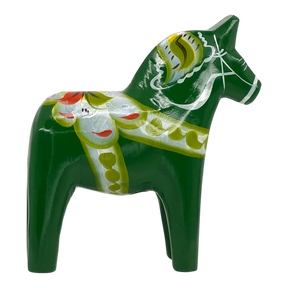 Green Swedish Dala horse carved from wood, featuring yellow, white, and red painted patterns, shown on a white background.
