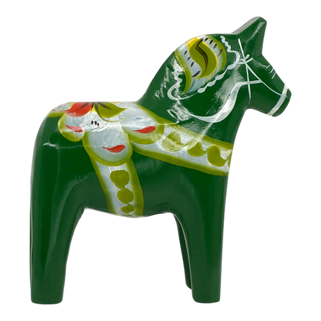 Green Swedish Dala horse carved from wood, featuring yellow, white, and red painted patterns, shown on a white background.