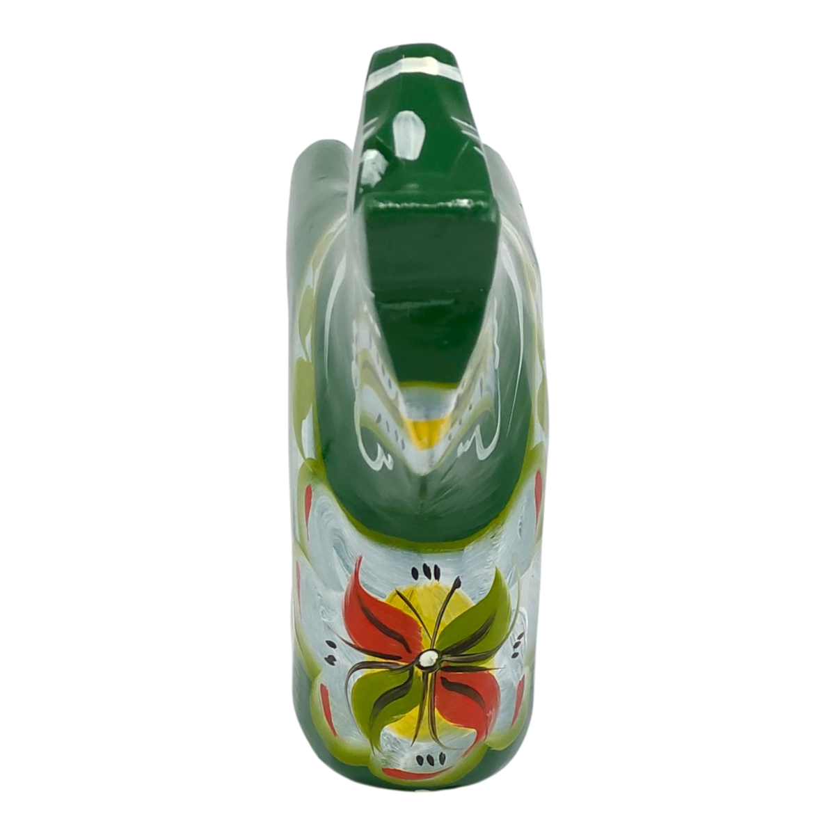 Green Swedish Dala horse figurine with red, yellow, and white floral patterns painted on its body, shown against a white background.