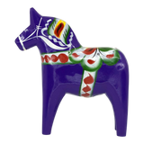 Purple Swedish Dala horse carved from pine wood, featuring painted green, red, white, and yellow decorative patterns on its body.