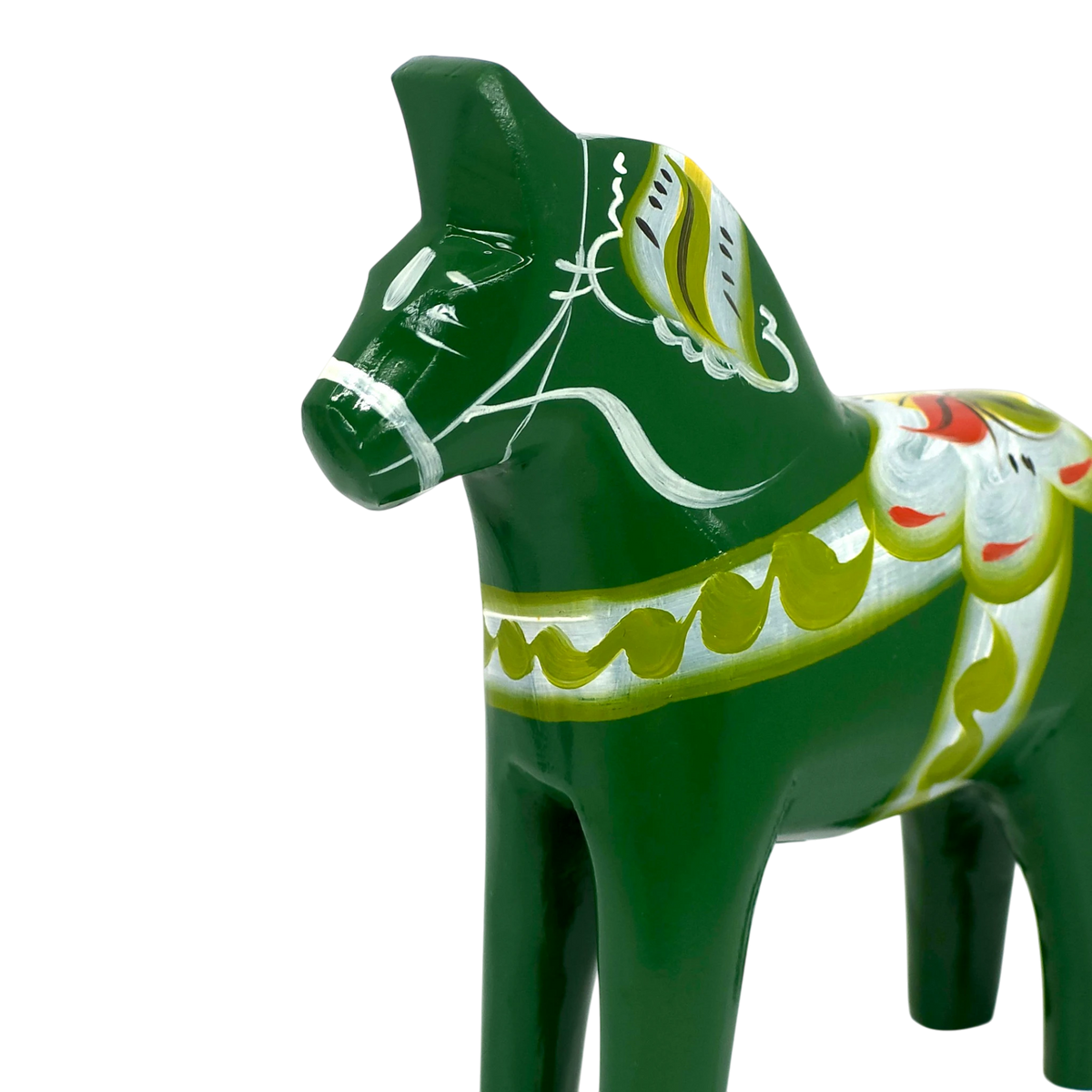 Green Swedish Dala horse figurine with white, yellow, and red painted patterns, shown on a plain white background.