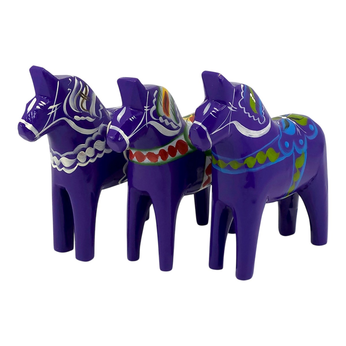 Three purple Dala Horse figurines made of Swedish pine wood, each hand-painted with colorful Scandinavian patterns, displayed side by side.