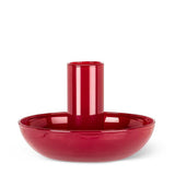 The Candle Holder: Small Pipe Taper Holder-Red (2"H) features a glossy ceramic finish, cylindrical center, and wide dish base—ideal modern table decor. Shown against a white background.