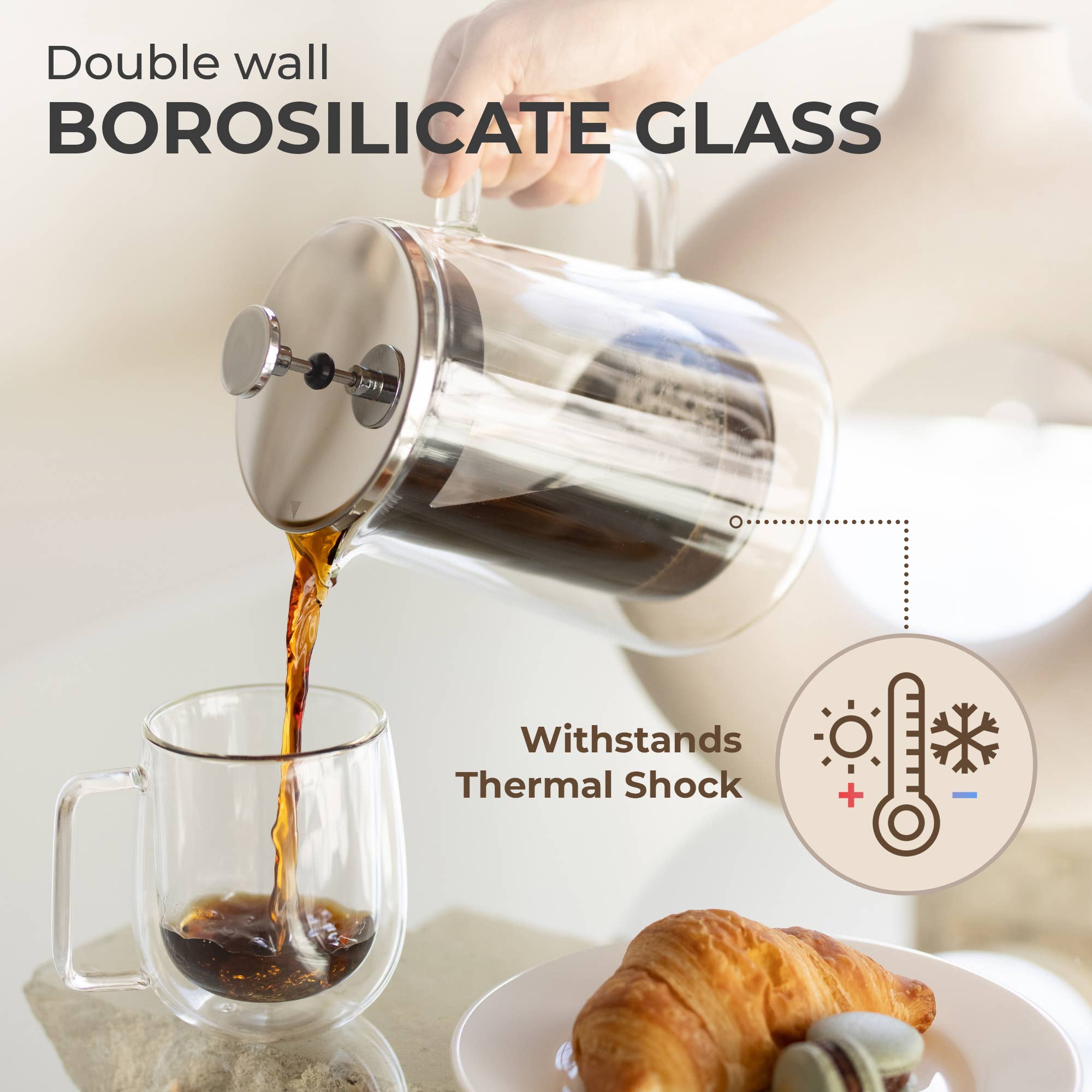 A hand pours coffee from the Kaffe French Press Coffee Maker – Double-Wall Borosilicate Glass (0.8L) into a glass mug, with a croissant on a plate nearby. Text highlights thermal shock resistance and premium materials.