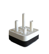 The Stumpastaken Fyran Four Candle Holder is a square, white powder-coated holder crafted from 100% recycled material—an elegant embodiment of sustainable interior decor and timeless Swedish design.
