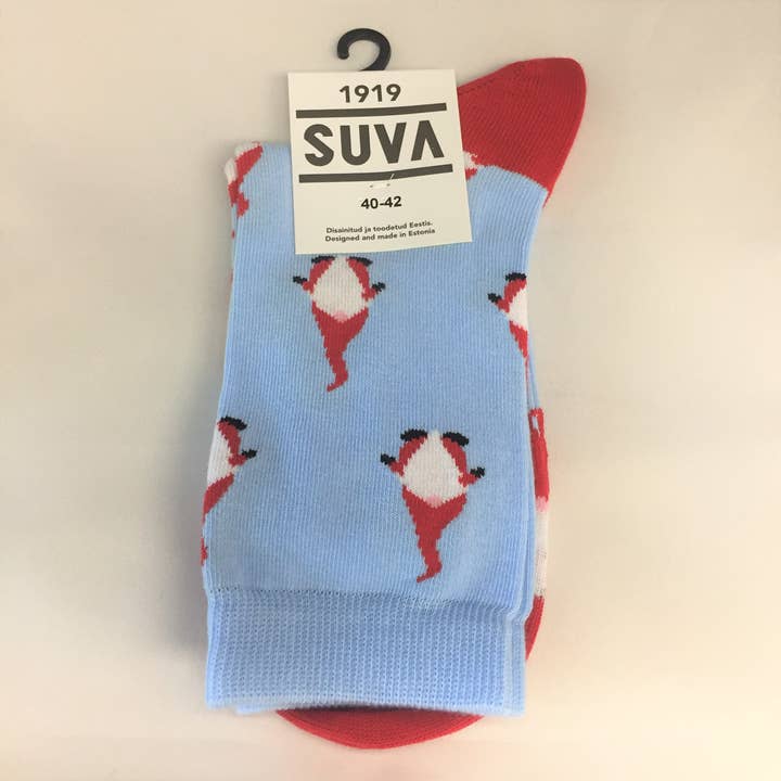 These ethically crafted Gnome socks from Estonia are blue with red heels and toes, feature a pattern of dancing gnomes, and the label reads SUVA 1919, 36-38, Designed in Scandinavia.