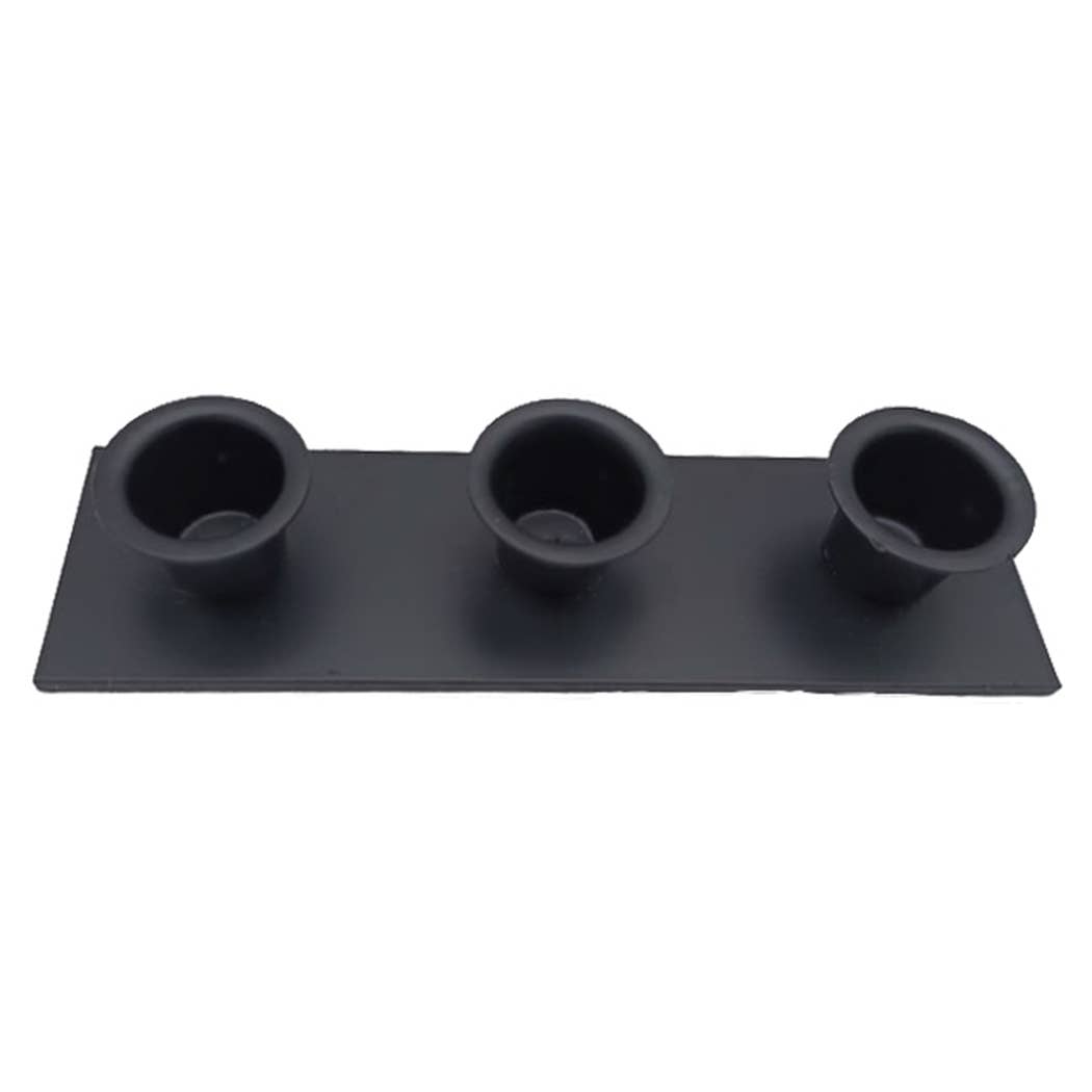 Introducing the Candle Holder: Triple Wrought Iron Taper Holder, boasting a sleek black rectangular base with three evenly spaced round, indented holders, ideal for creating a captivating centerpiece to display your candle designs.