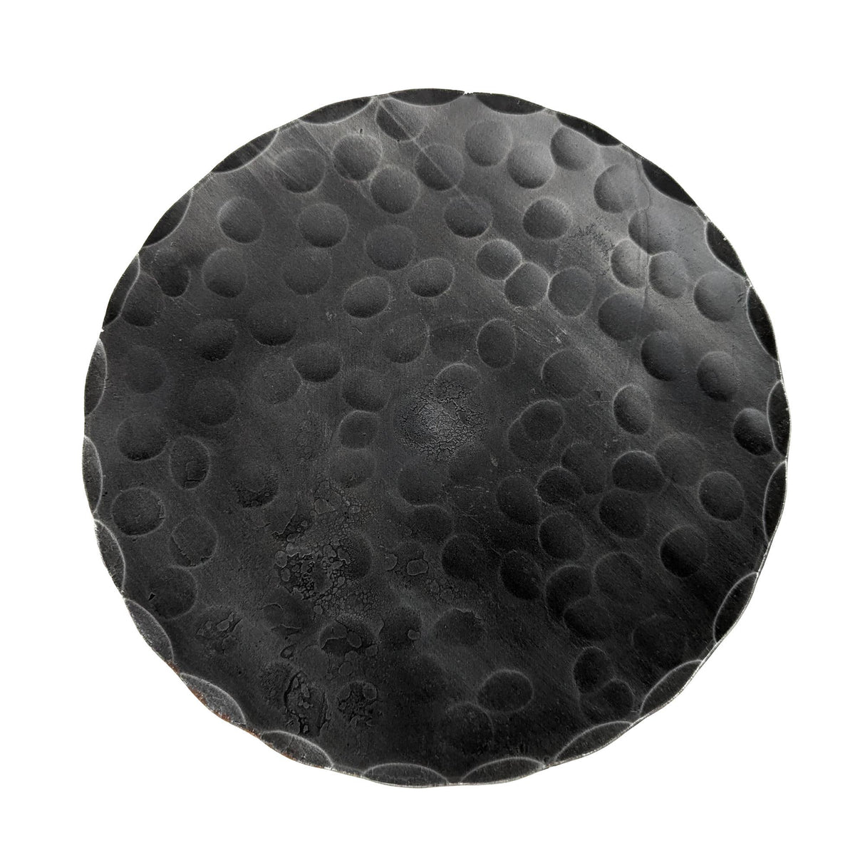 The Candle Holder: Forged Steel Pillar Candle Base (4.75" diameter) features a round, black matte finish with a raised dot pattern, adding artisanal flair to any setting.