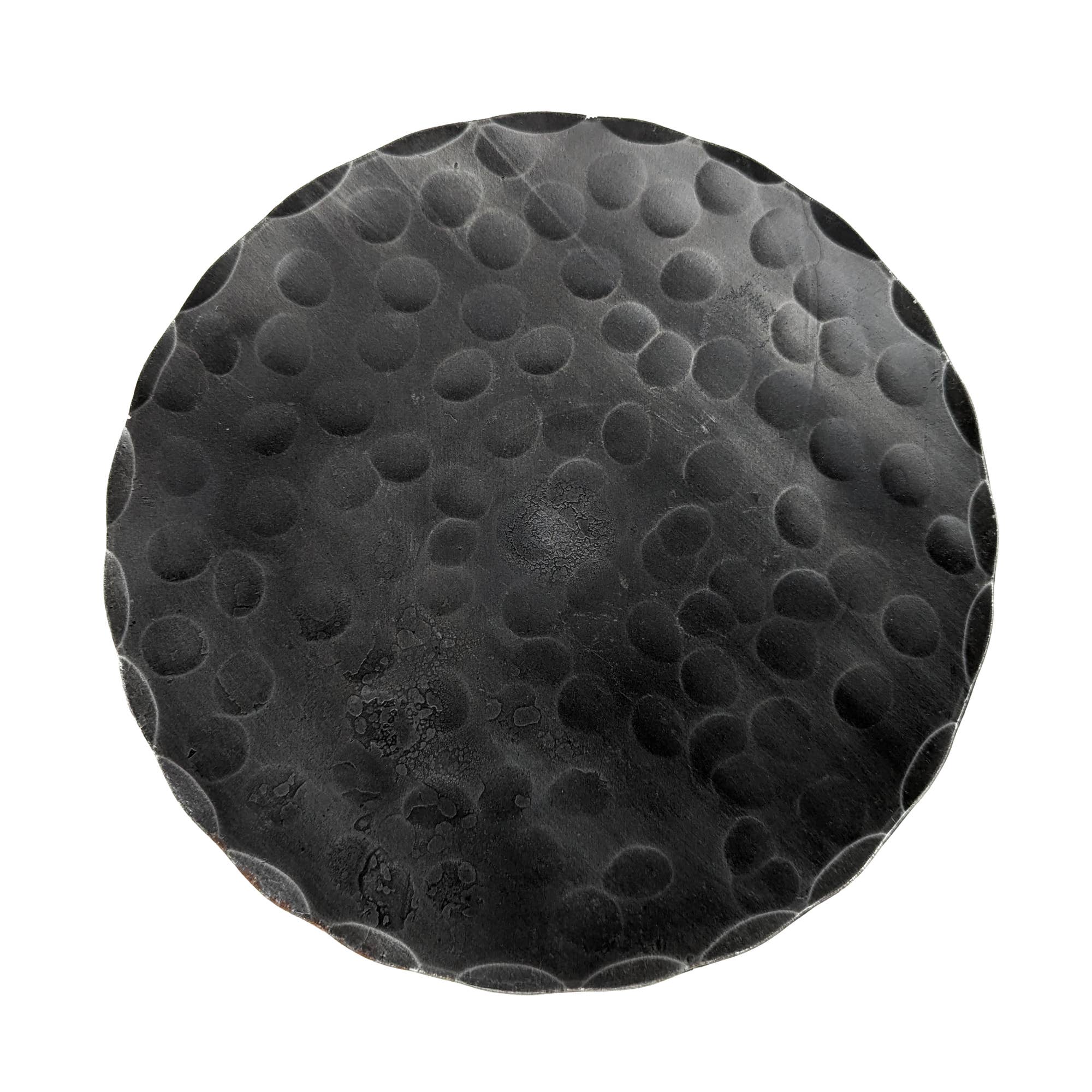 The Candle Holder: Forged Steel Pillar Candle Base (4.75" diameter) features a round, black matte finish with a raised dot pattern, adding artisanal flair to any setting.