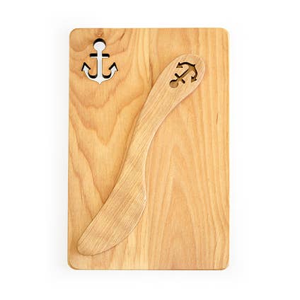 The Board & Spreader: Anchor Sandwich Board and Spreader is laser cut from alder wood, featuring an anchor-shaped cutout in the top left corner and a matching spreader engraved with an anchor, resting on the board.