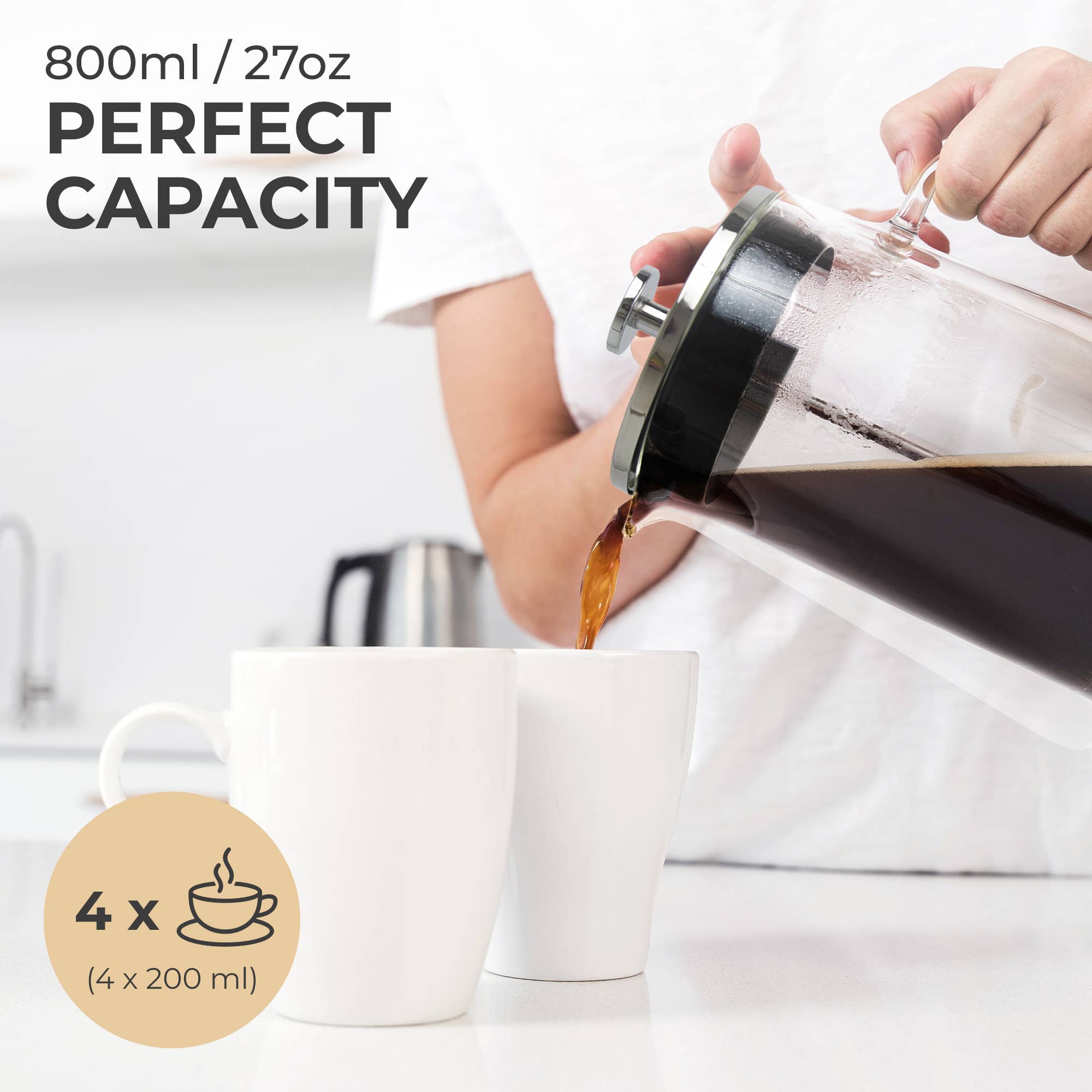 Someone pours coffee from the Kaffe French Press Coffee Maker – Double-Wall Borosilicate Glass (0.8L) into a white mug in a kitchen. Text notes its 800ml/27oz capacity, enough to serve four 200ml cups.