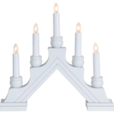 The Star Trading Karin is a white electric 5-light candelabra, featuring candle-shaped bulbs on a stepped base in an arch—classic Swedish Christmas décor and an elegant indoor centerpiece.