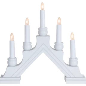 The Star Trading Karin is a white electric 5-light candelabra, featuring candle-shaped bulbs on a stepped base in an arch—classic Swedish Christmas décor and an elegant indoor centerpiece.