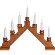 The Candelabra: Star Trading - Karin Electric 7-Light is a traditional Swedish Christmas candlestick with a wooden design, featuring seven white candles in a triangular step pattern, all beautifully lit.