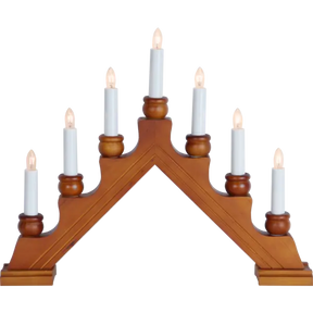 The Candelabra: Star Trading - Karin Electric 7-Light is a traditional Swedish Christmas candlestick with a wooden design, featuring seven white candles in a triangular step pattern, all beautifully lit.