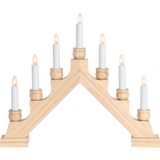 The Candelabra: Star Trading - Karin Electric 7-Light from Sweden showcases a triangular, wooden design with seven illuminated white candles.