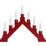 The Candelabra: Star Trading Karin Electric 7-Light in red, brown, or gray features seven white electric candles arranged in a triangular arch, inspired by Swedish Christmas traditions.
