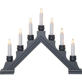 The Candelabra: Star Trading - Karin Electric 7-Light features black triangular design with nine glowing white candles, reminiscent of a traditional Swedish Christmas candlestick, arranged in an elegant ascending order on each side.