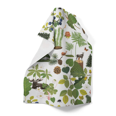 The "Skogsliv" Forest Life Tray by Arvidssons Textil of Sweden (8.5x13 in) features forest plants, pinecones, leaves, mushrooms, berries, and animals like a moose and wolf on a white background.