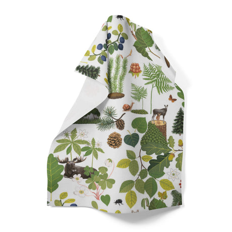 The "Skogsliv" Forest Life Tray by Arvidssons Textil of Sweden (8.5x13 in) features forest plants, pinecones, leaves, mushrooms, berries, and animals like a moose and wolf on a white background.