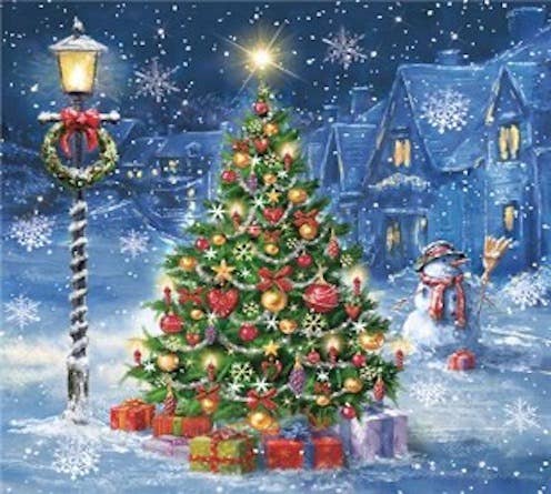 Create a festive setting with Napkins: Christmas Eve in Scandinavian Village Lunch Paper Napkins (20 pkg), featuring a snowy outdoor scene with a decorated tree, presents, snowman, houses, and falling snow—ideal for holiday gatherings.